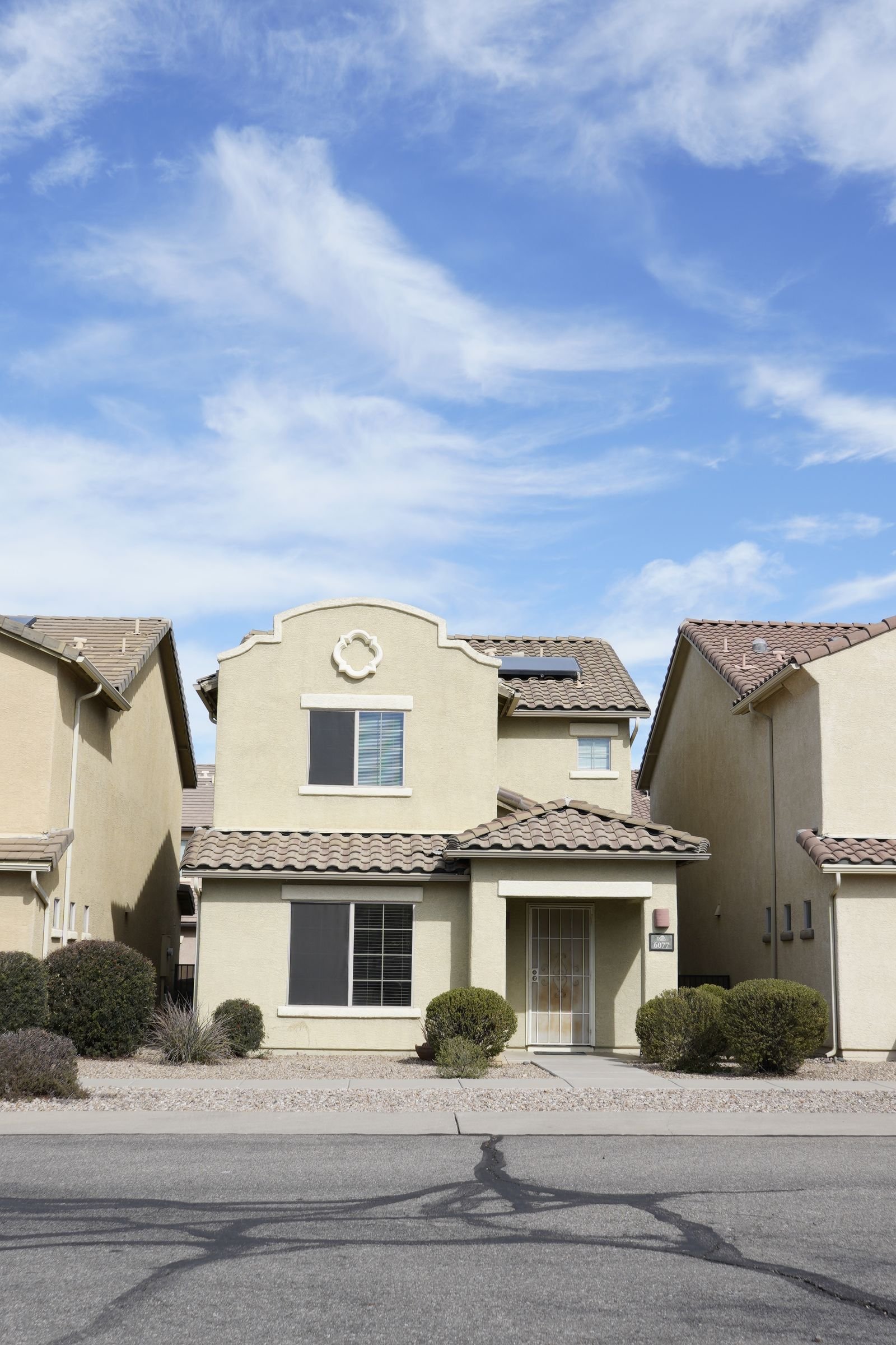 Stucco and tile-roofed house in a Southwestern suburb