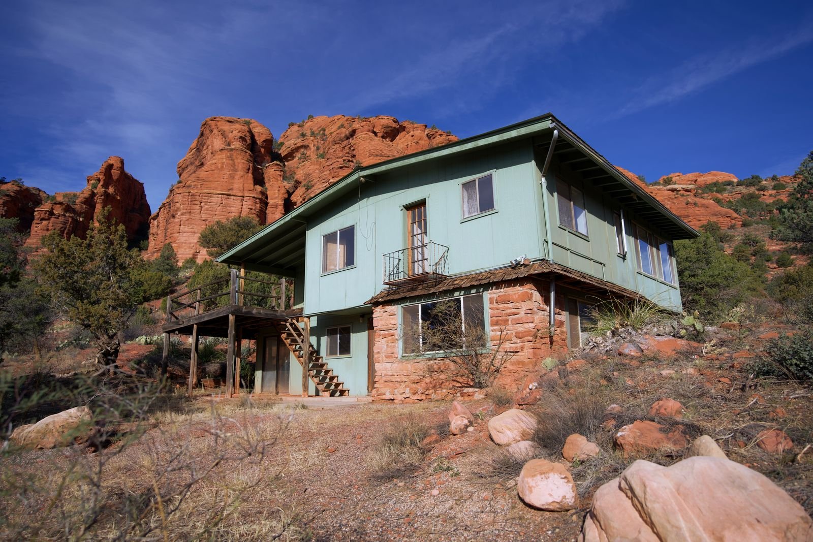 House built among red rock formations